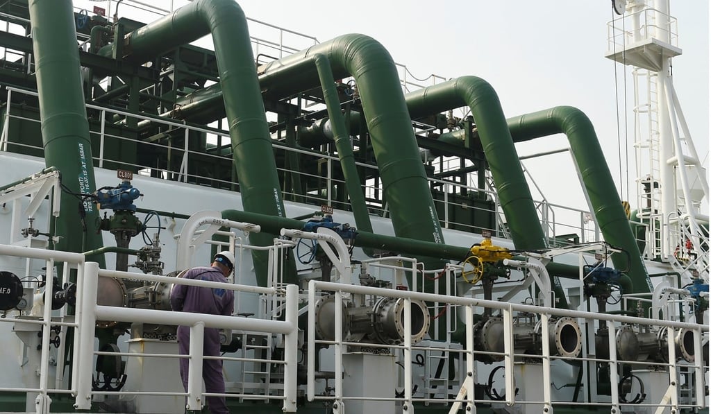A man works on a liquefied natural gas tanker at a port operated by CNOOC in Tianjin, northern China. Photo: Reuters