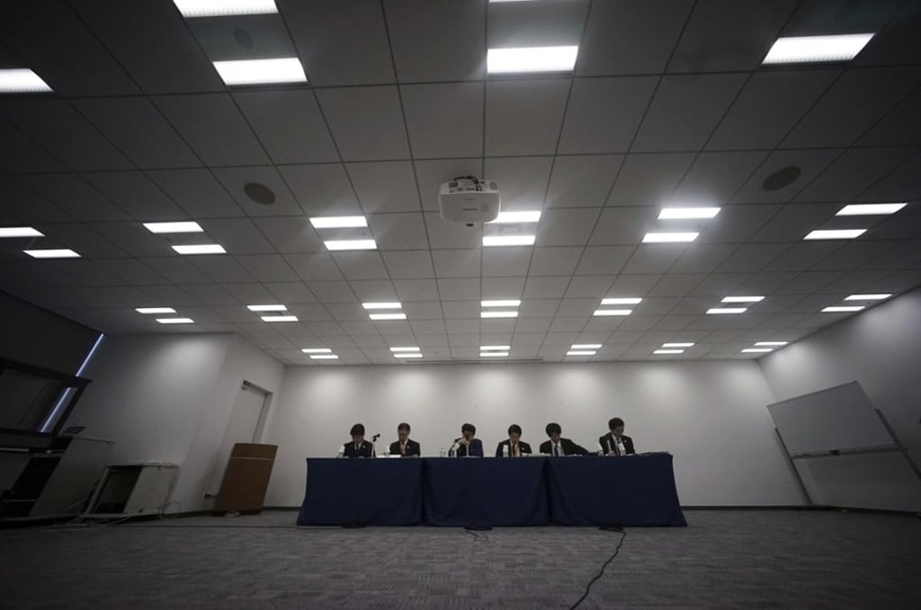 Officials from the Tokyo 2020 Games and Tokyo municipal government announce the updated version of the Games budget in Tokyo. Photo: AP