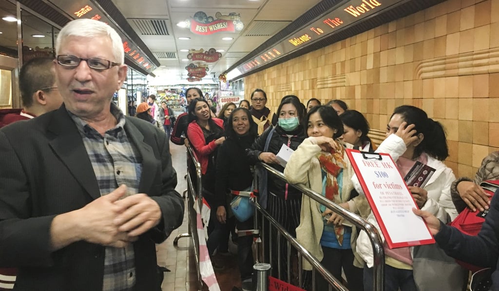 A Pakistani owner (left) of a Hong Kong money exchange shop has offered HK$100 to each helper affected by the saga. Photo: Peace Chiu