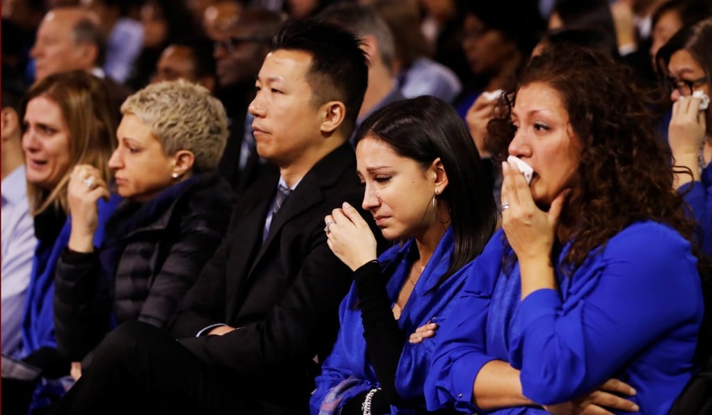Mourners weep during a memorial service for Apotex pharmaceutical billionaire Barry Sherman and his wife Honey. Photo: Reuters