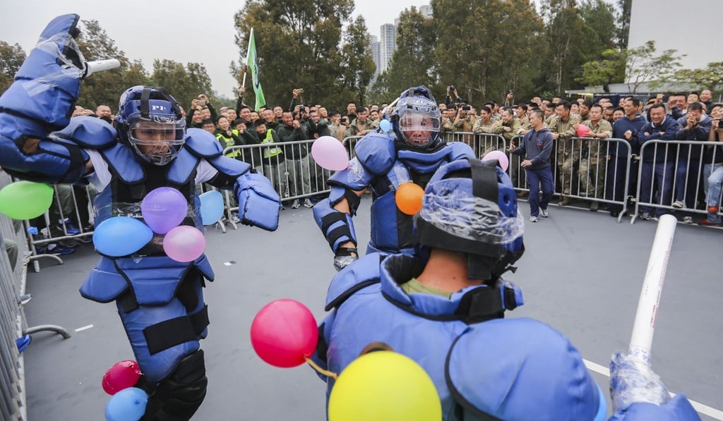 The ‘Redman Rumble’ is another favourite challenge. Officers wearing protective gear have to burst opponents’ balloons taped to their bodies – using foam batons. Photo: Xiaomei Chen