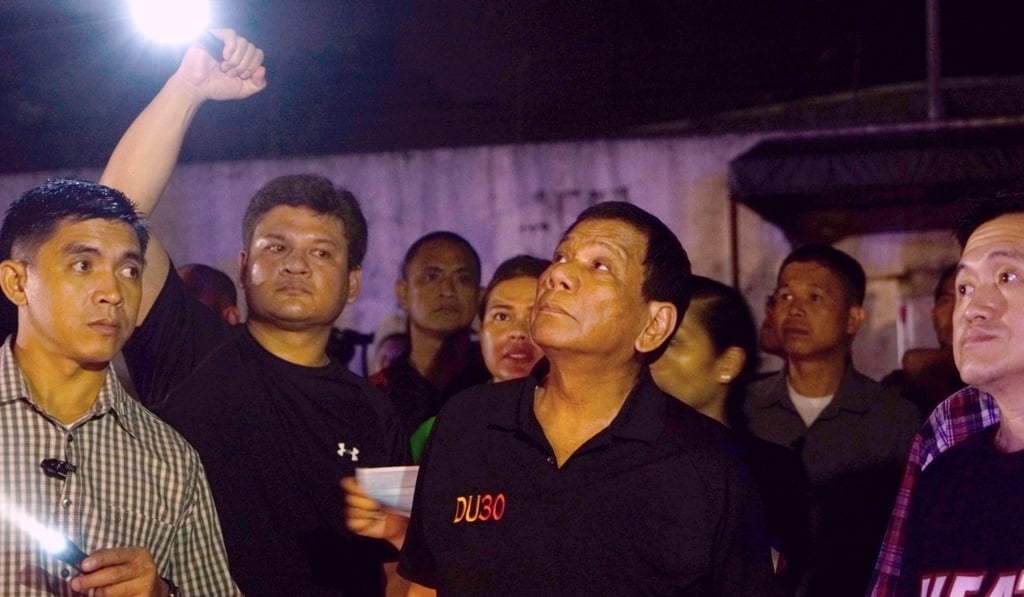 Philippine President Rodrigo Duterte at the scene. Photo: EPA