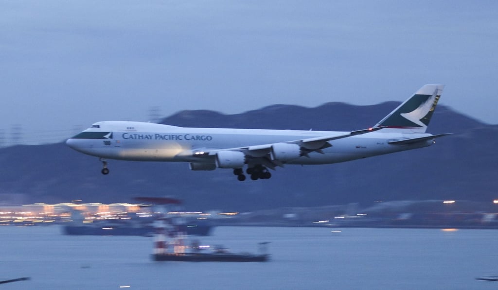 A Cathay Pacific cargo aircraft is seen landing at Hong Kong International Airport. Photo: Roy Issa