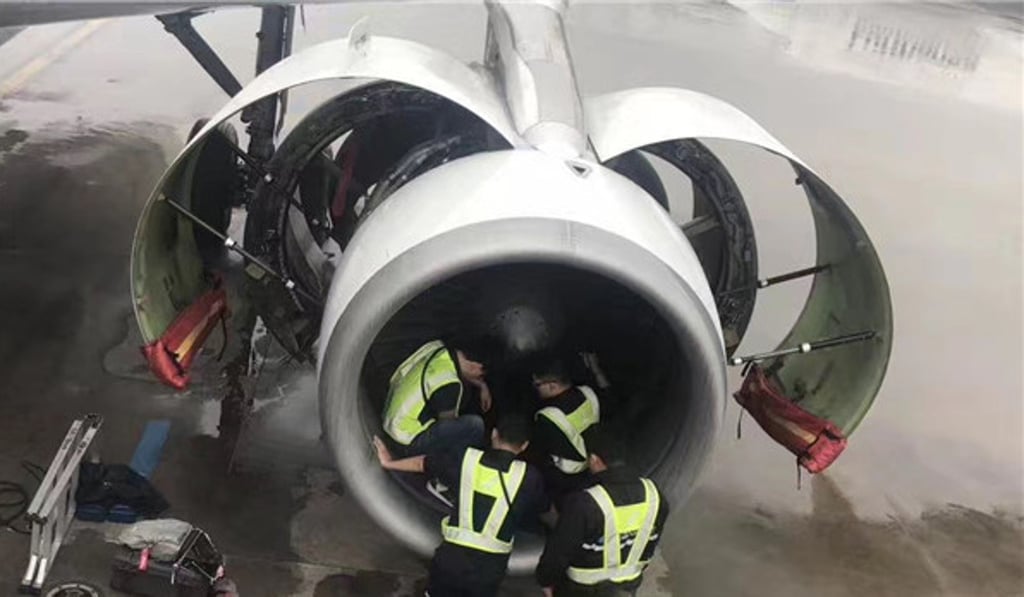 The China Southern Airlines flight 380 from Shanghai Pudong Airport to Guangzhou was delayed after an elderly woman passenger was suspected of throwing coins in the plane's engine. Photo: Handout