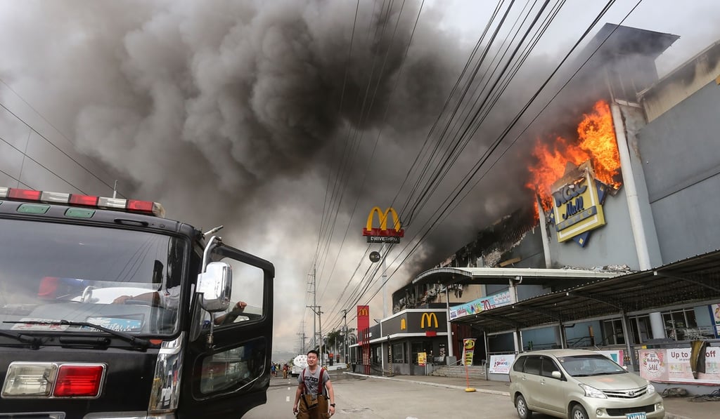 Some 37 people died in this blaze at a shopping centre in Davao Philippines. Photo: AFP Some 37 people died in this blaze at a shopping centre in Davao Philippines. Photo: AFP