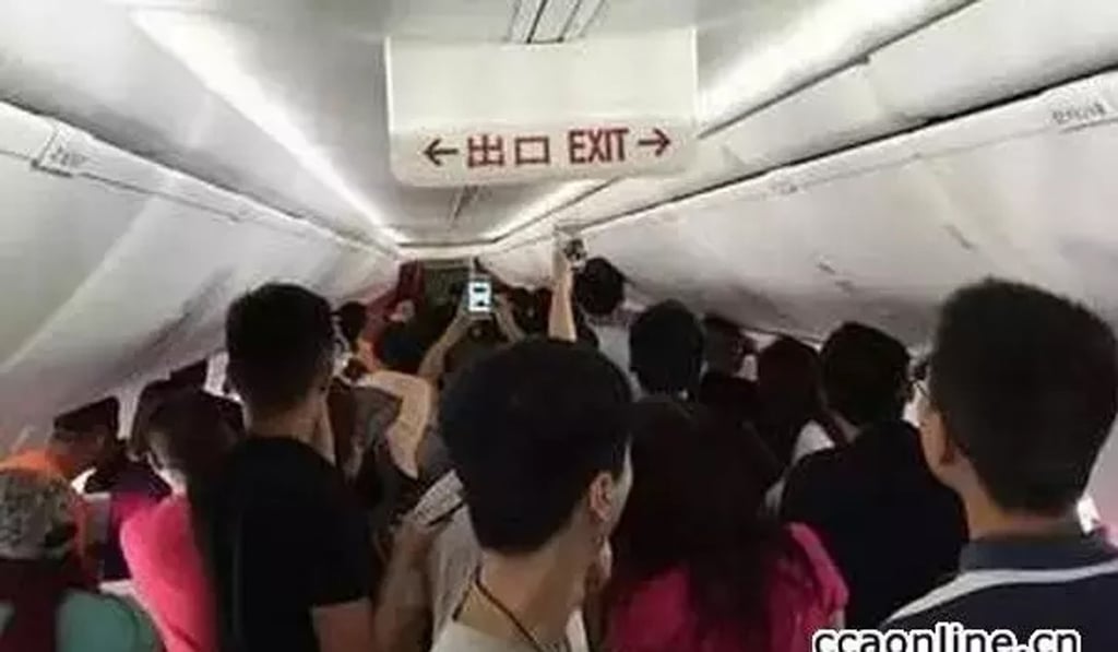 Pictures shared online showing passengers taking photos during the incident. Photo: Handout