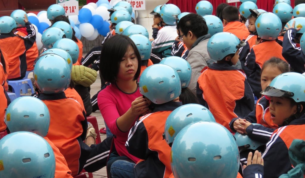 Children take part in a traffic safety awareness campaign at a school in Hanoi. Photo: Isabelle Taft