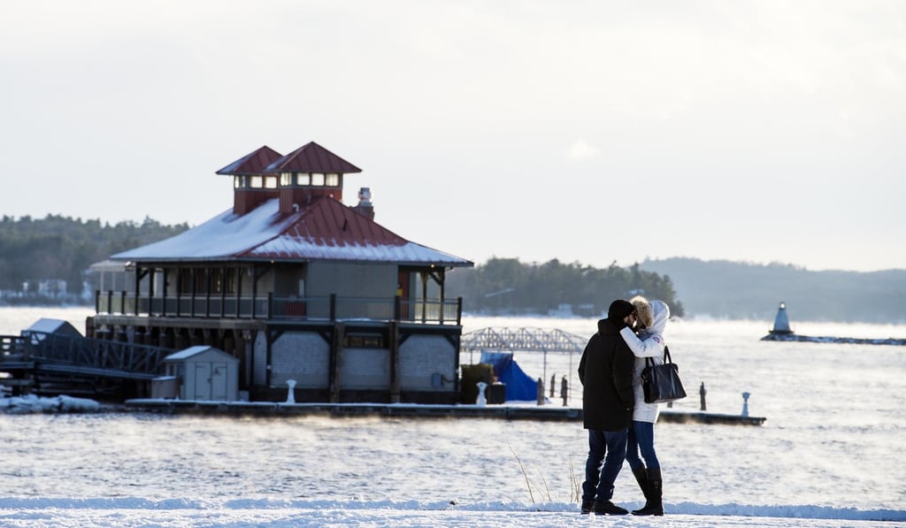 A couple embraces as they brave the cold weather for a walk in Waterfront Park in Burlington, Vermont, on Wednesday. Photo: AP