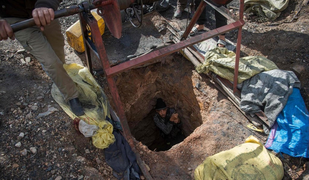 Moroccan men work an abandoned coal mine in the northeastern city of Jerada. In the neglected northern Moroccan mining city, hundreds of people risk their lives every day to scrape a meagre living from perilous abandoned coal pits. Photo: Agence France-Presse
