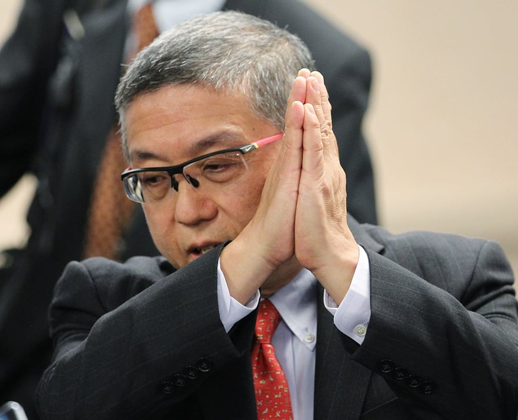 Johnny Chen (Centre), Chairman of Convoy Global Holdings speaks to the media after an Extraordinary General Meeting for shareholders, at Hutchison House in Central. Photo: SCMP / Roy Issa