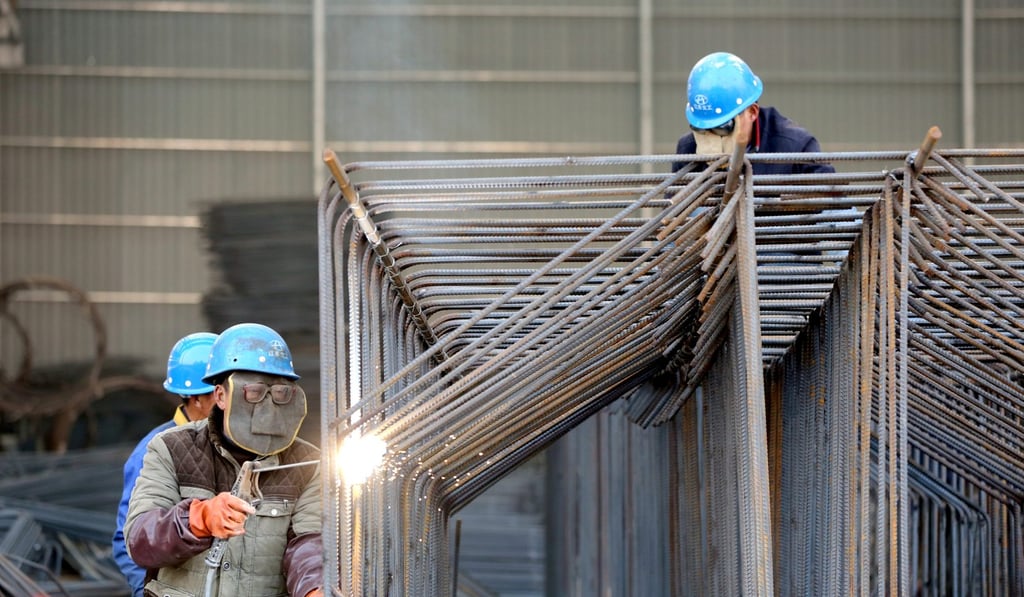 Workers weld steel bars at a construction site in Huai'an, Jiangsu province. Photo: Reuters