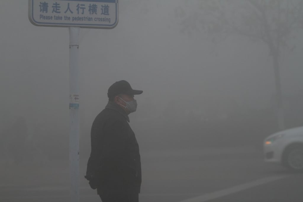 A man wears a face mask as fog, or maybe smog, shrouds the city of Jinan in eastern China’s Shandong province on Friday. Photo: Reuters