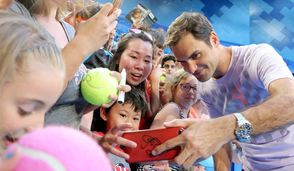 Roger Federer takes a selfie with fans at the Perth Arena during the Hopman Cup. Photo: EPA Roger Federer takes a selfie with fans at the Perth Arena during the Hopman Cup. Photo: EPA