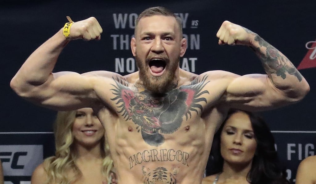 Conor McGregor stands on a scale during the weigh-in event at UFC 205. UFC President Dana White says he is unsure how long McGregor can keep his lightweight title without defending it. Photo: AP
