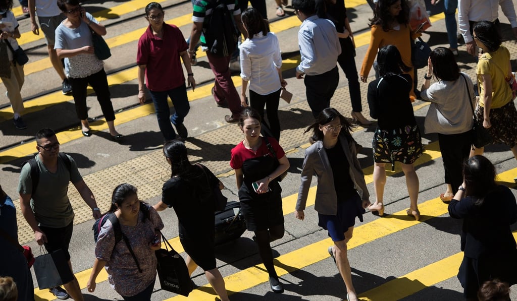 Hong Kong has the longest working hours in the world, according to a survey last year by investment bank UBS. Photo: EPA