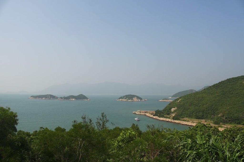 A view of the Tai A Chau coastline, with The Floatudio anchored offshore and other Soko Islands in the distance. Photo: Stuart Heaver