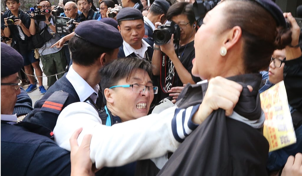 Activists clash with security guards outside the square. Photo: Felix Wong