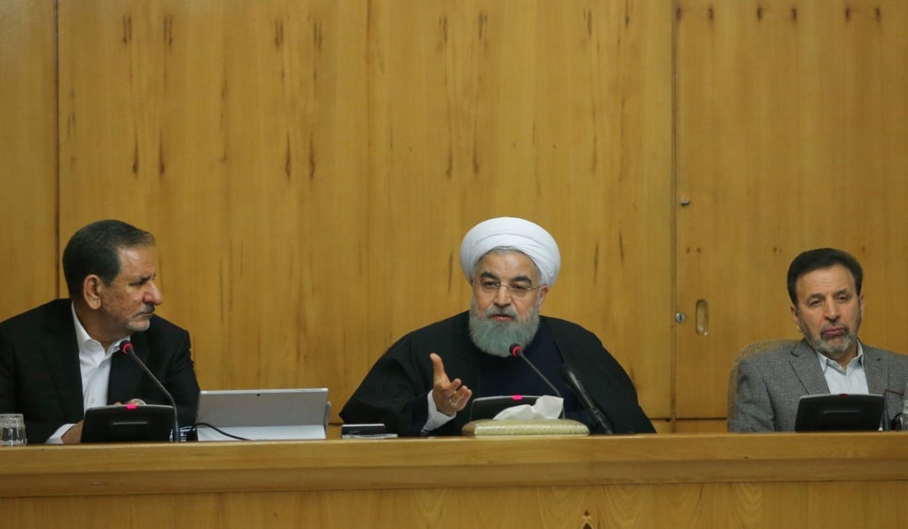 A handout picture provided by the office of Iranian President Hassan Rowhani on December 31, 2017 shows him (C) attending a cabinet meeting in the capital Tehran. Photo: AFP