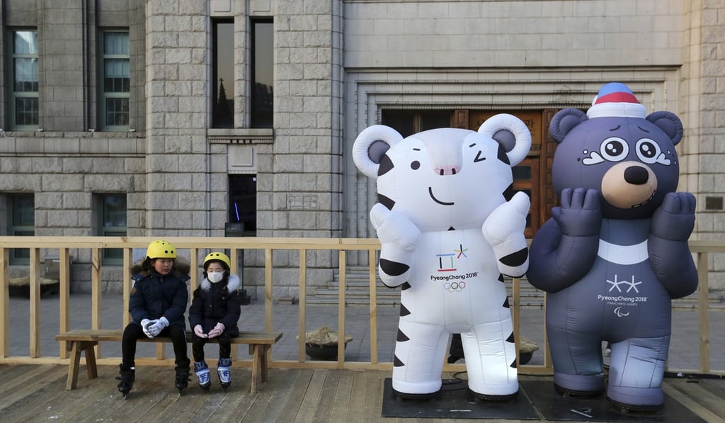 Children sit next to the 2018 Pyeongchang Winter Olympic Games' official mascots in Seoul. Photo: AP