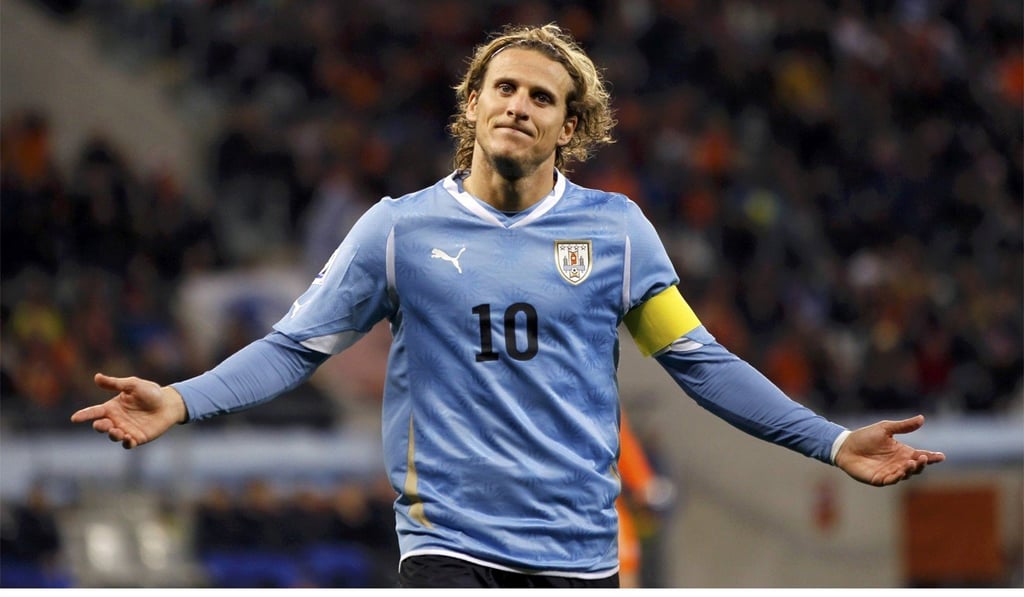 Diego Forlan reacts during their 2010 World Cup semi-final match against the Netherlands. Photo: Reuters