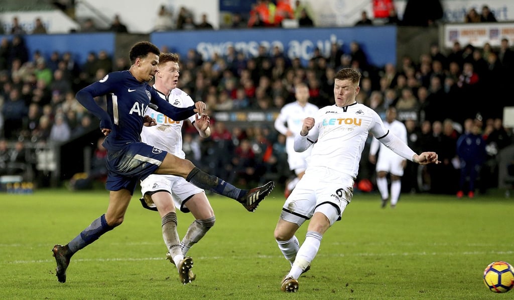 Tottenham Hotspur's Dele Alli shoots before scoring his side's second goal against Swansea. Photo: AP