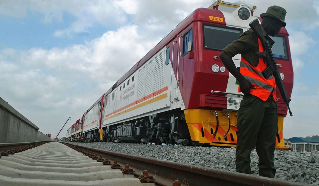 A security guard patrols a railway being built by China connect Kenya, Uganda, Rwanda and South Sudan to the port of Mombasa. Photo” AFF