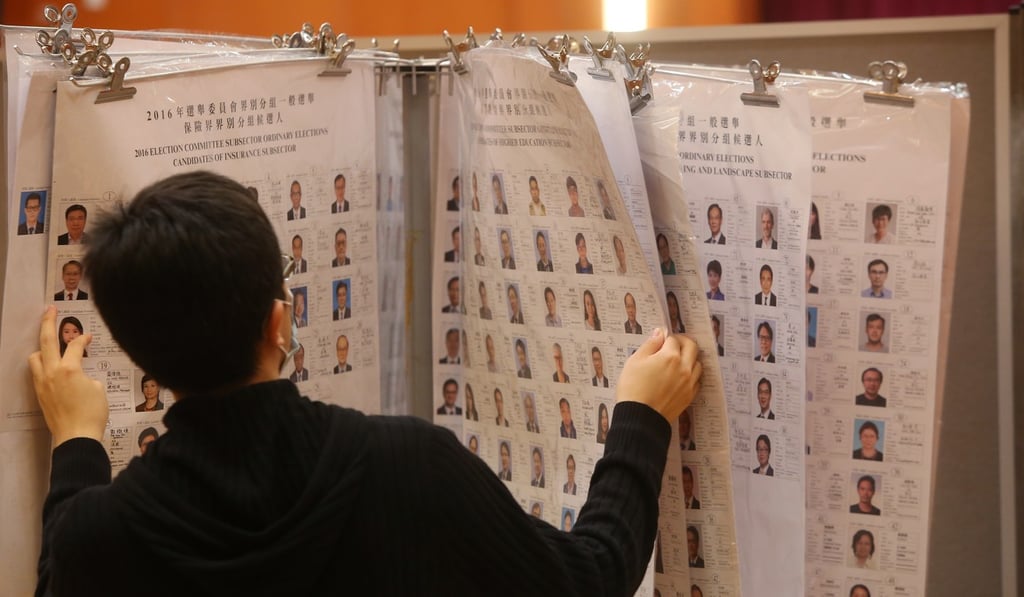 A voter looks at information about candidates at a Quarry Bay polling station for 2016 elections. Photo: Sam Tsang