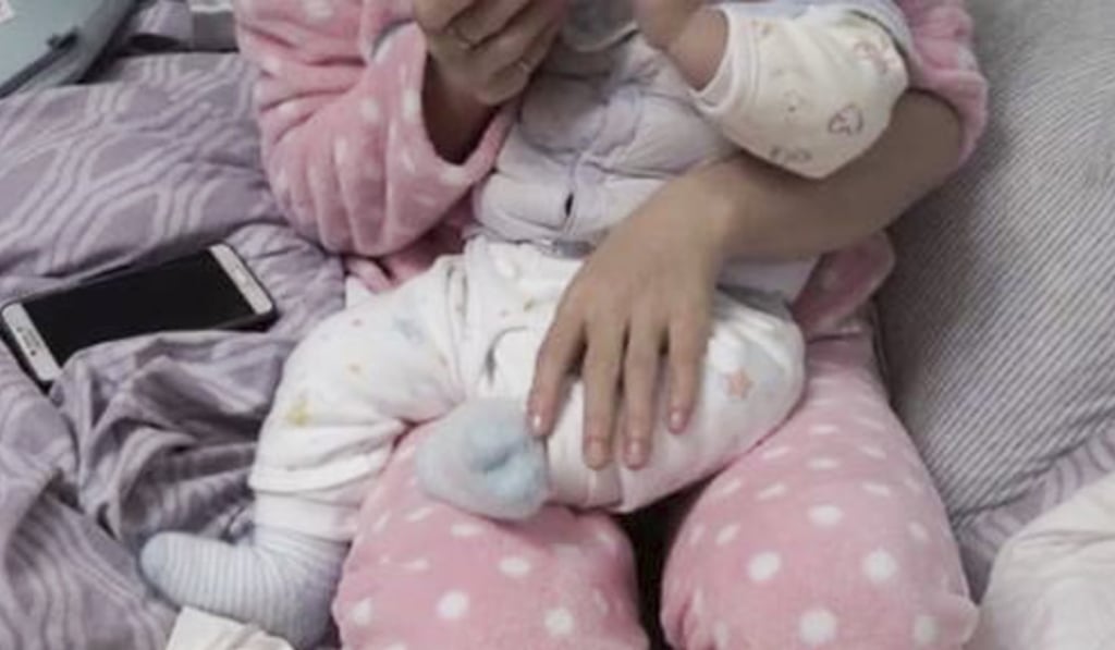 The baby boy was born in Cambodia in July and diagnosed with brain atrophy in October. Photo: Sina.cn