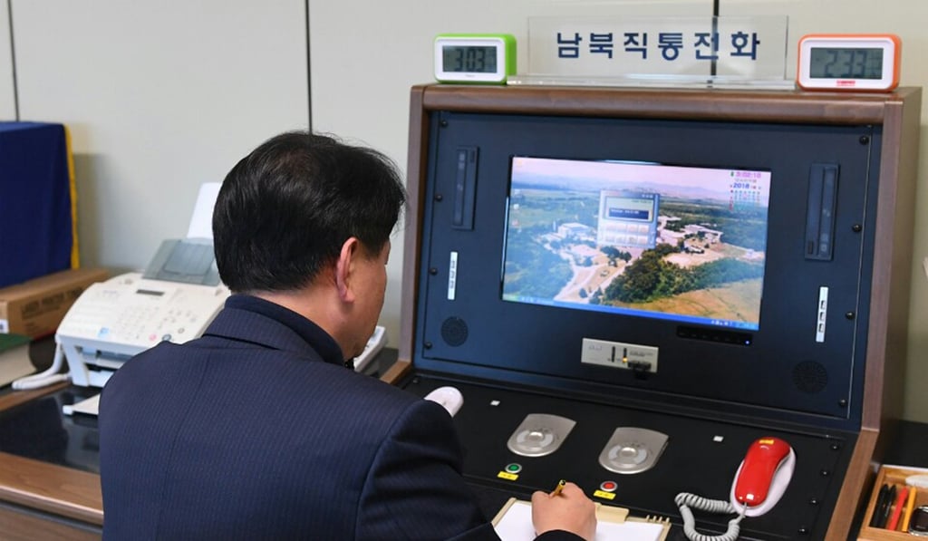 A South Korean government official checks the direct communications hotline to talk to the North Korean side, at the border village of Panmunjom in South Korea on January 3. North Korea reopened a key cross-border communication channel with South Korea on Wednesday and the two Koreas are expected to have talks on January 9. Photo: Yonhap via AP