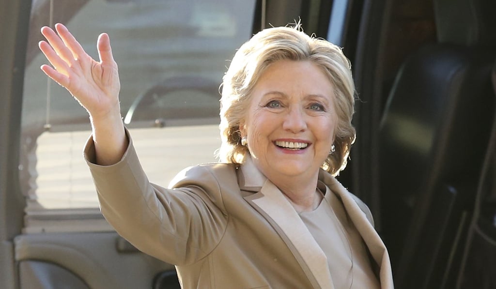 Hillary Clinton waves as she arrives to vote at her polling place in Chappaqua, New York. The FBI is investigating donations to the Clinton Foundation. Photo: AP Hillary Clinton waves as she arrives to vote at her polling place in Chappaqua, New York. The FBI is investigating donations to the Clinton Foundation. Photo: AP