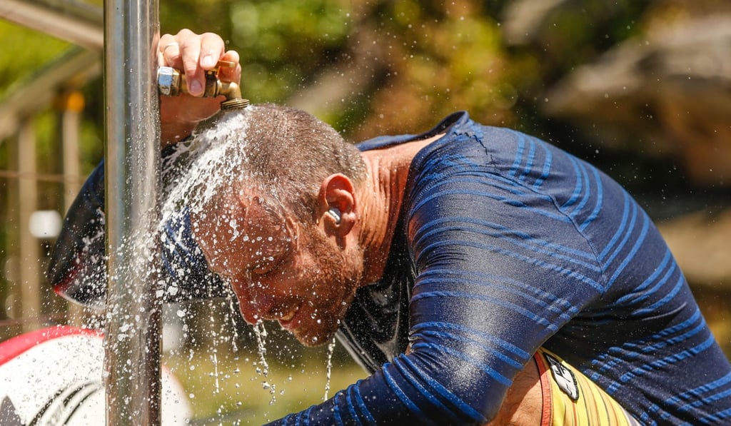 Surfer Brenton Fisher cools off at Tamarama beach in Sydney on Sunday. Photo: EPA