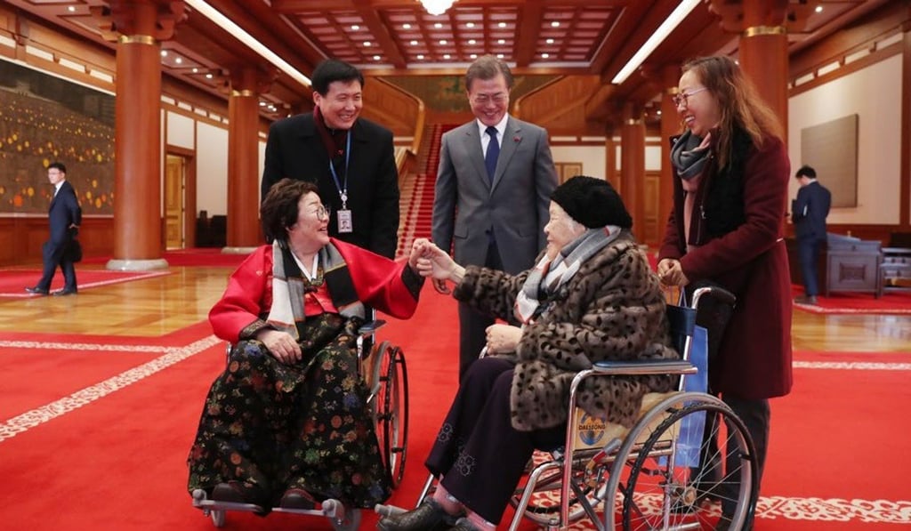 South Korean President Moon Jae-in (centre) and aides welcome former comfort women to the presidential office in Seoul, on January 4. Photo: EPA -EFE South Korean President Moon Jae-in (centre) and aides welcome former comfort women to the presidential office in Seoul, on January 4. Photo: EPA -EFE