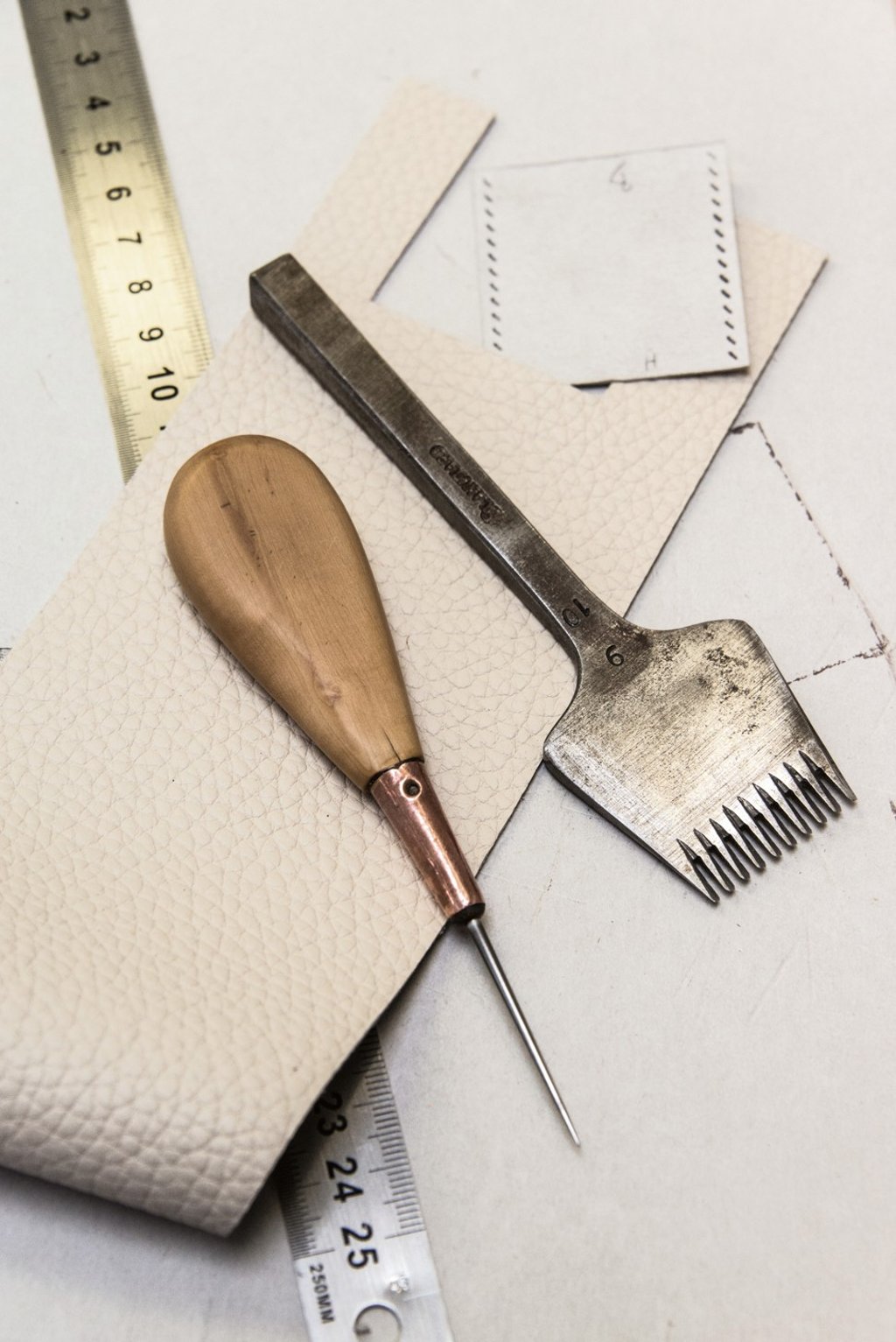 The awl and chisel, the tools of leather hand stitching.