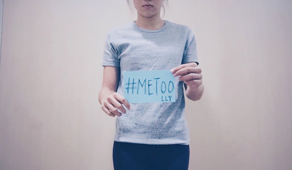 Hong Kong hurdler Vera Lui Lai-yiu holds a #MeToo sign with her initials, which she posted on Facebook as she accused a former coach of sexually assaulting her when she was a schoolgirl. Photo: AFP
