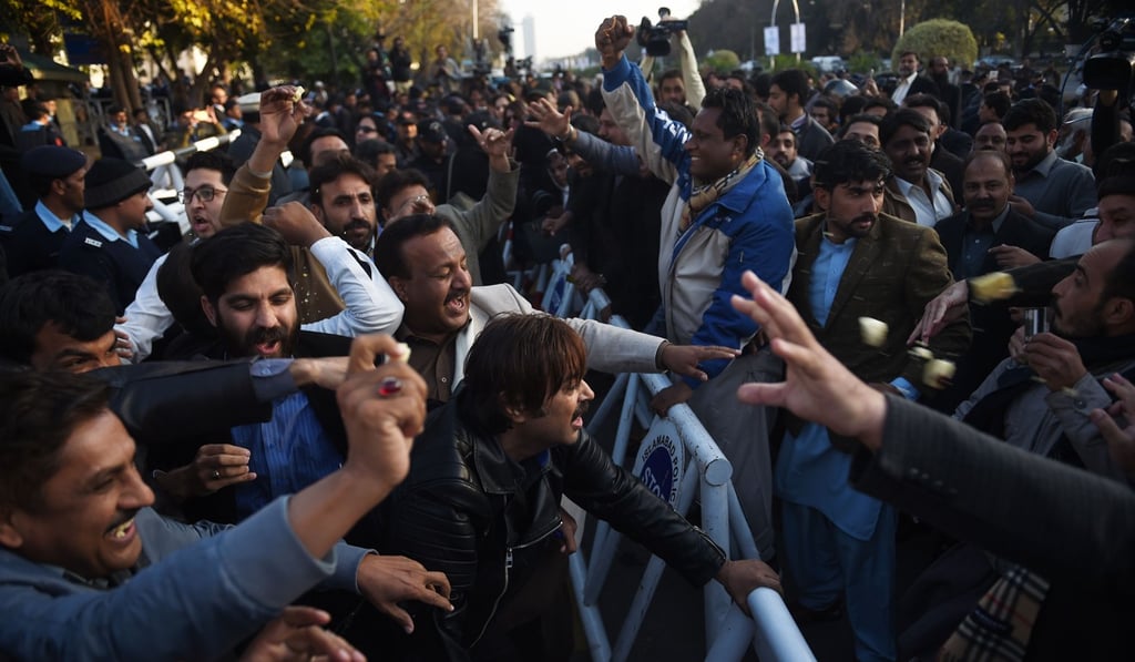 Activists of Pakistan opposition party Tehreek-e-Insaf scuffle with ruling party Pakistan Muslim League activists outside the Supreme Court building in Islamabad in December. Photo: AP Activists of Pakistan opposition party Tehreek-e-Insaf scuffle with ruling party Pakistan Muslim League activists outside the Supreme Court building in Islamabad in December. Photo: AP