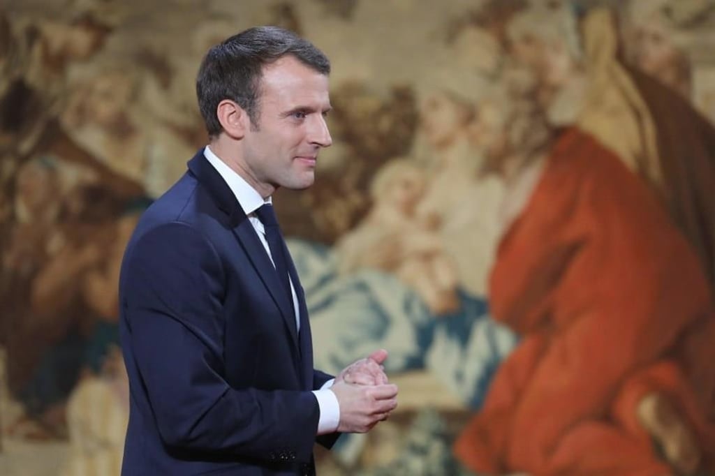 French President Emmanuel Macron leaves after delivering his New Year wishes. Photo: AFP/LUDOVIC MARIN