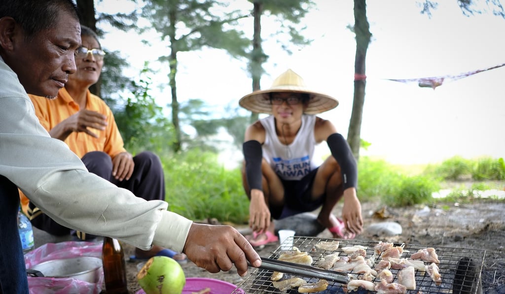 Locals have a barbecue by the beach in Taimali, Taiwan. Photo: James Wendlinger