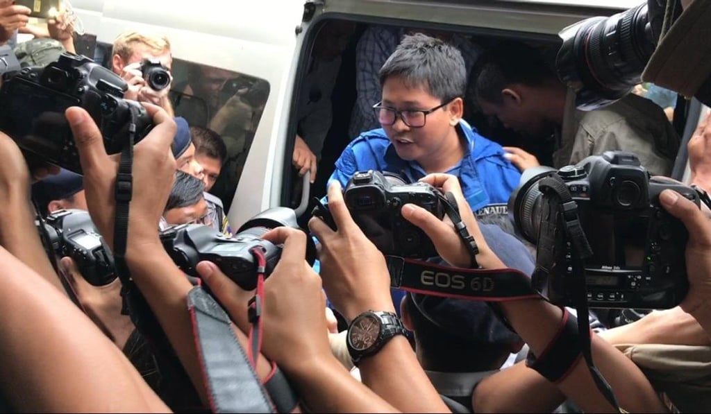 Reuters journalist Wa Lone exits a police van at a Yangon court. Photo: Kyodo Reuters journalist Wa Lone exits a police van at a Yangon court. Photo: Kyodo