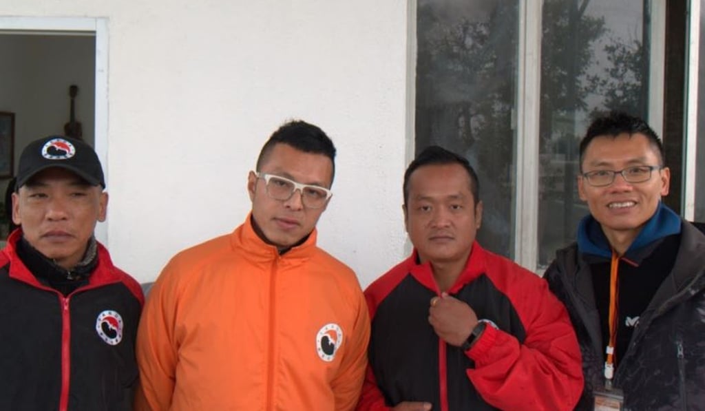 Lou Chi Hung (L) and Ray Leung Hoi-tat (R), social workers on SKC, introduced Allen Yuen (2L) and Thapa Magar Ramu to running. Photo: Mark Agnew