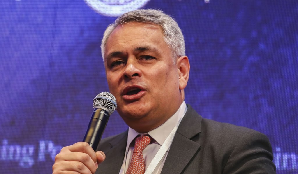 John Woods of Credit Suisse said during a panel debate at the China Conference that a fully convertible yuan ‘is not going to happen any time soon’. Photo: Nora Tam