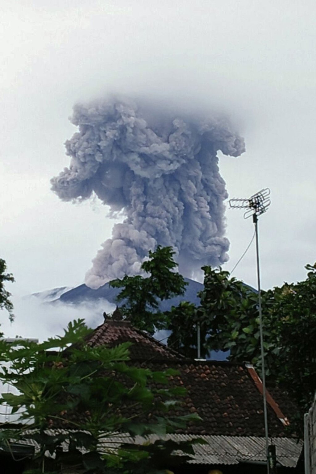 Indonesia’s Mount Agung on Bali island spews ash into the air on Thursday. While the volcano appeared to be belching less ash and smoke, experts warned a major eruption could still happen at any moment. Agung has already experienced a series of mini eruptions. Photo: AFP/National Disaster Mitigation Agency