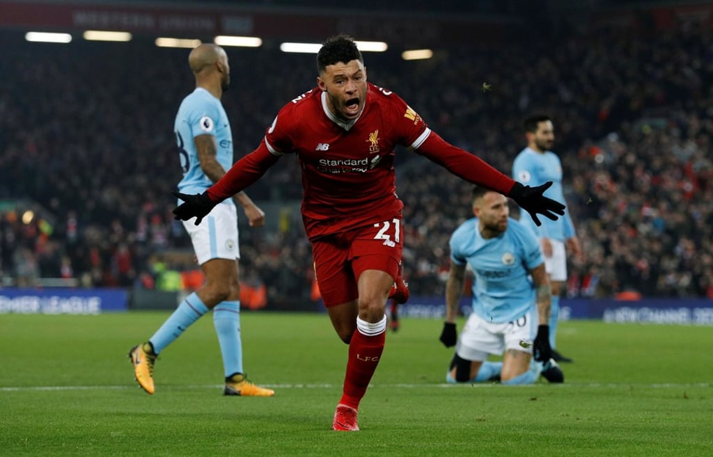 Alex Oxlade-Chamberlain celebrates after firing in the opener. Photo: Reuters