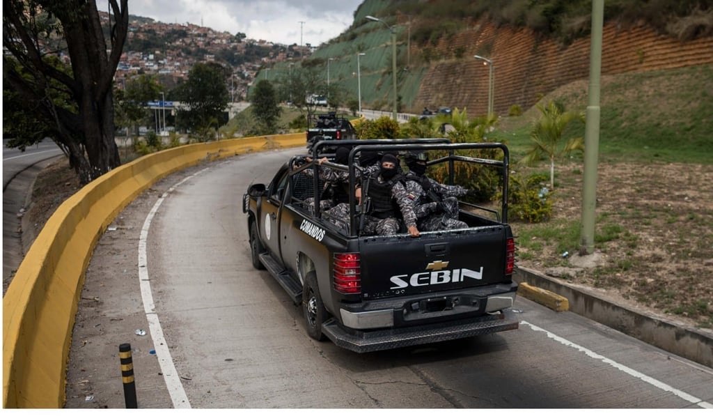Members of the Bolivarian Armed Forces head to the location of Oscar Perez’s “terrorist” group in the El Junquito neighbourhood outside Caracas on Monday. Photo: EPA