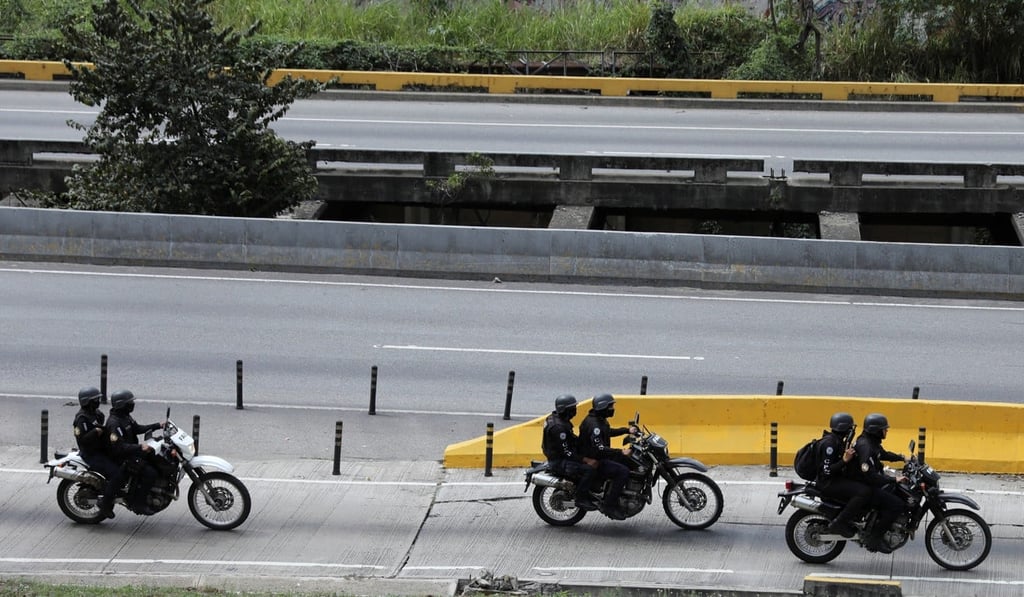 Tactical police members ride towards a shoot-out with rogue Venezuelan police officer Oscar Perez outside Caracas. Photo: Reuters