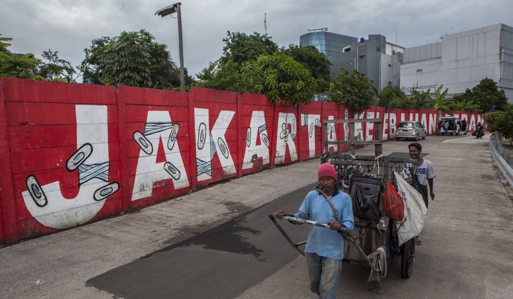 Popo’s mural “Jakarta Overload” on the side of the Sunter River, Jakarta. Photo: Agoes Rudianto