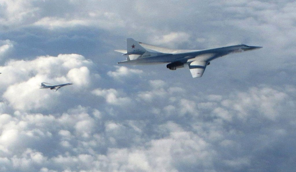 A handout photo made available by the British Ministry of Defence (MOD) showing a Russian Blackjack Tupolev Tu-160 long-range bombers being followed by a British Royal Air Force (RAF) Typhoon on Monday. Photo: British MOD via EPA-EFE