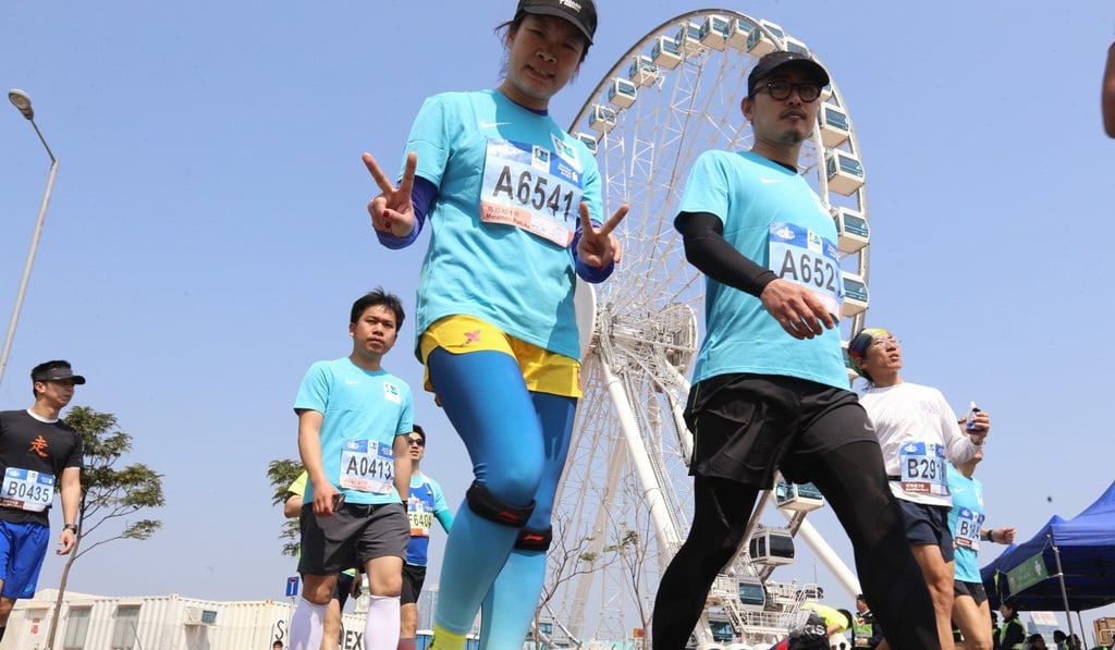 Runners should wear enough to keep themselves warm before, during and after the race. Photo: Dickson Lee