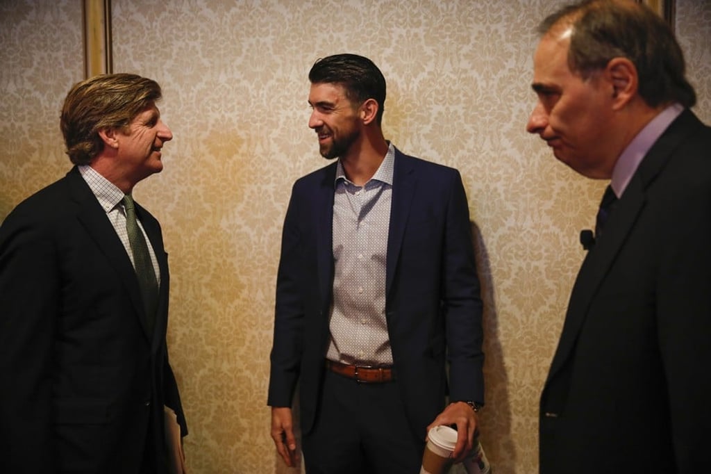 Michael Phelps (centre) before a breakfast event held at the Hilton Chicago in Chicago. Photo: TNS