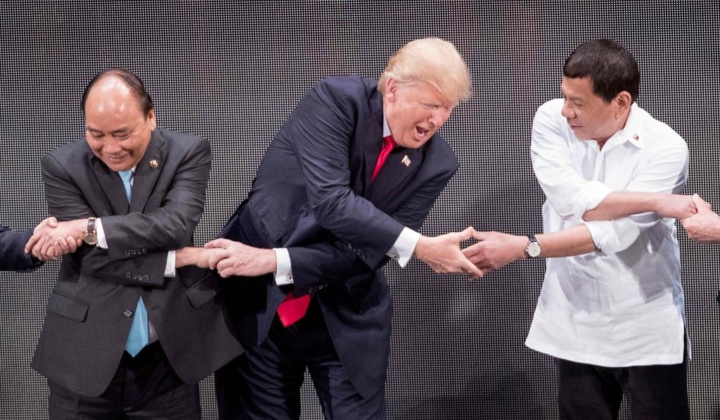 US President Donald Trump joins hands with Vietnam's Prime Minister Nguyen Xhan Phuc (left) and Philippine President Rodrigo Duterte for a photo op during the 31st Asean Summit in Manila in November. Trump’s statements and actions since becoming president have left many former allies, including in Asia, concerned and looking to strengthen alternative alliances. Photo: AFP