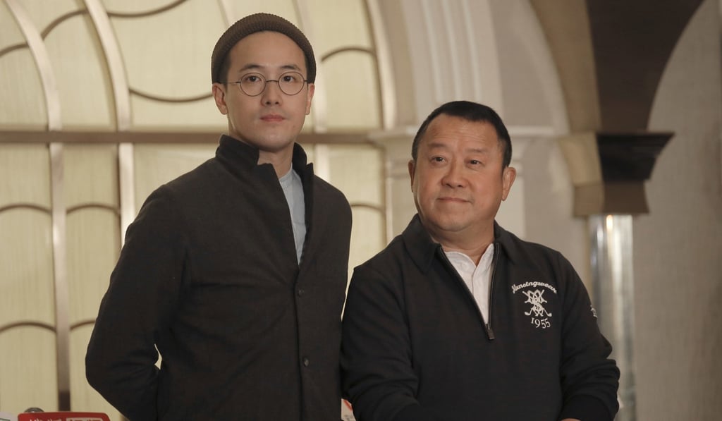 Eric Tsang, right, poses with his director son, Derek Tsang before the press conference on Wednesday. Photo: AP